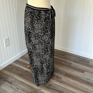 This is a maxi skirt, faux wrap, elastic back with a tie on the side. Large